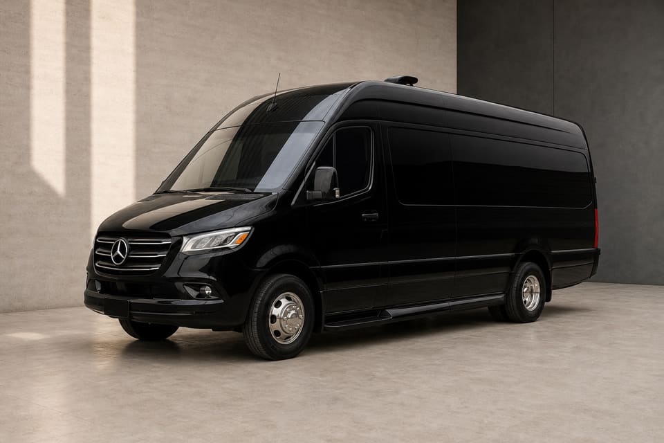 Black First Class Mercedes Sprinter Jet Class in a warm ivory studio